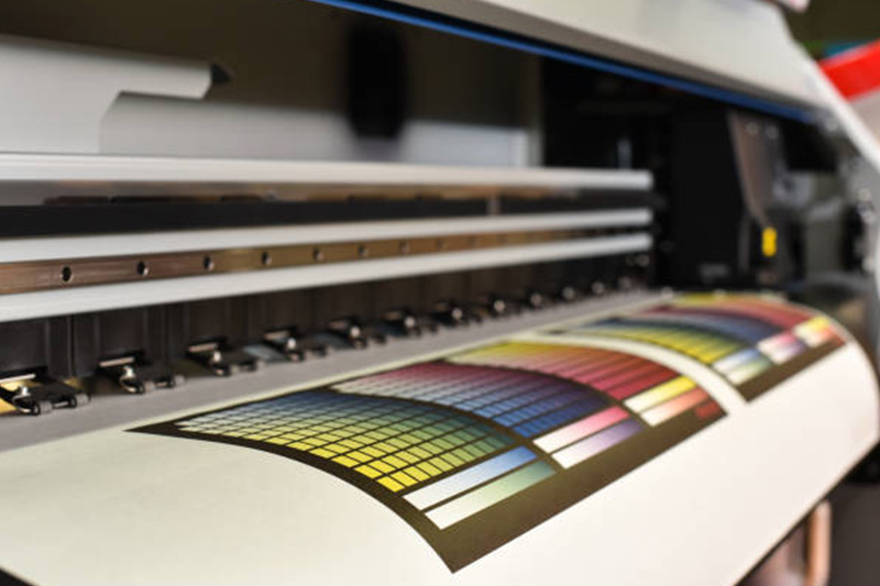 Test color sheet coming off a large format printer