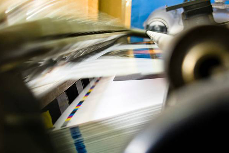 Printed paper running through a sheet fed printer